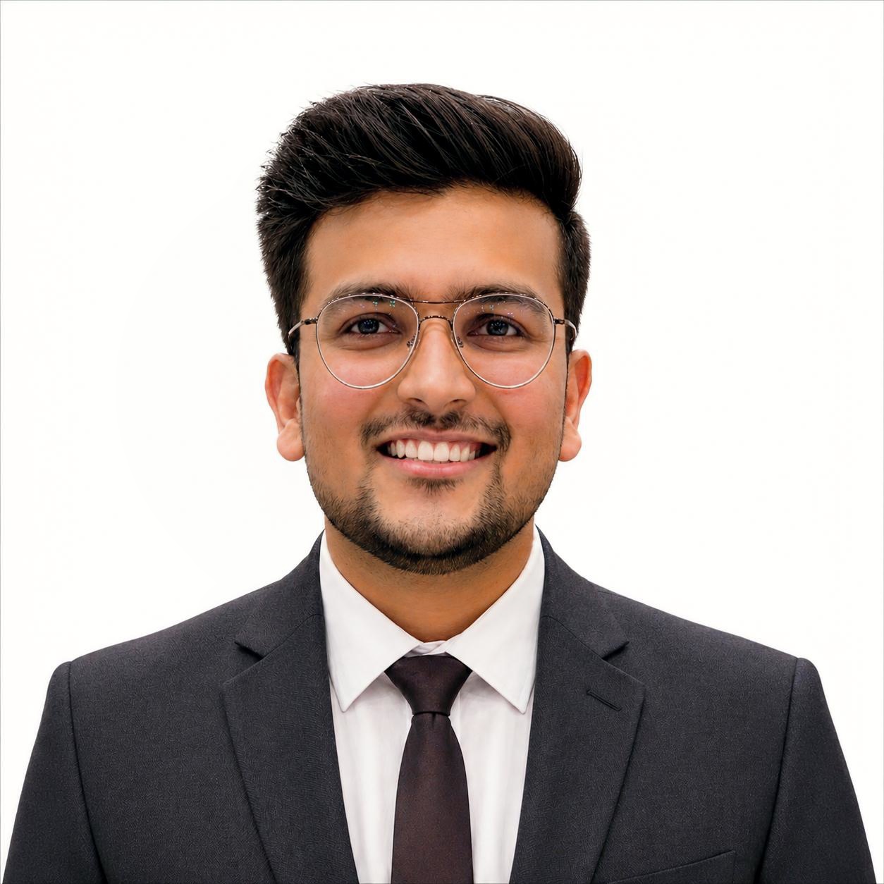 Portrait of Dr. Vinay Khandelwal, smiling, in a dark suit